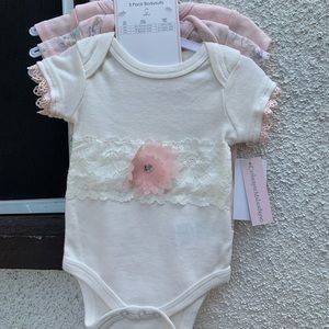 Catherine Malandrino 0-3 month onesies NWT.